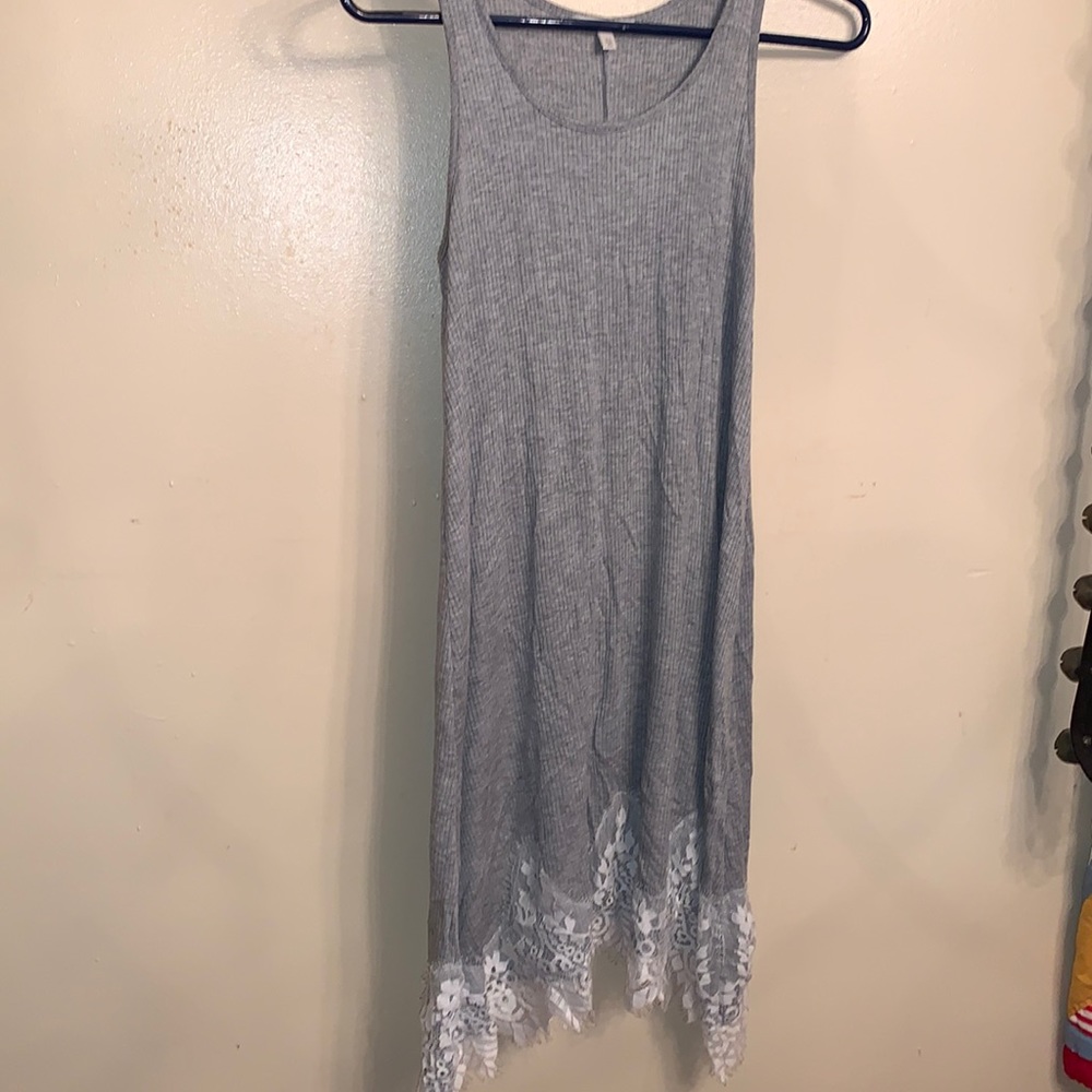 Grey dress with white lace material at the bottom